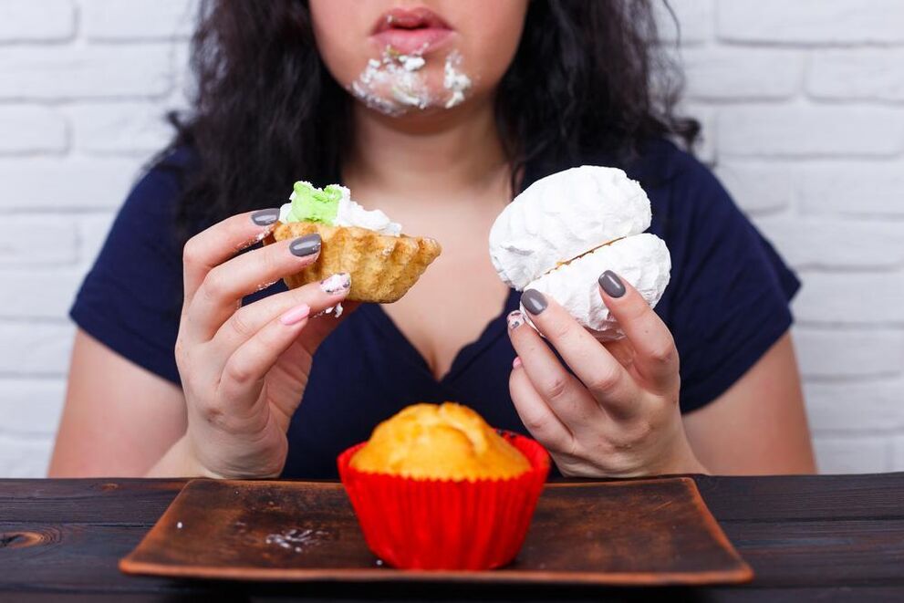 an overweight woman who eats sweets